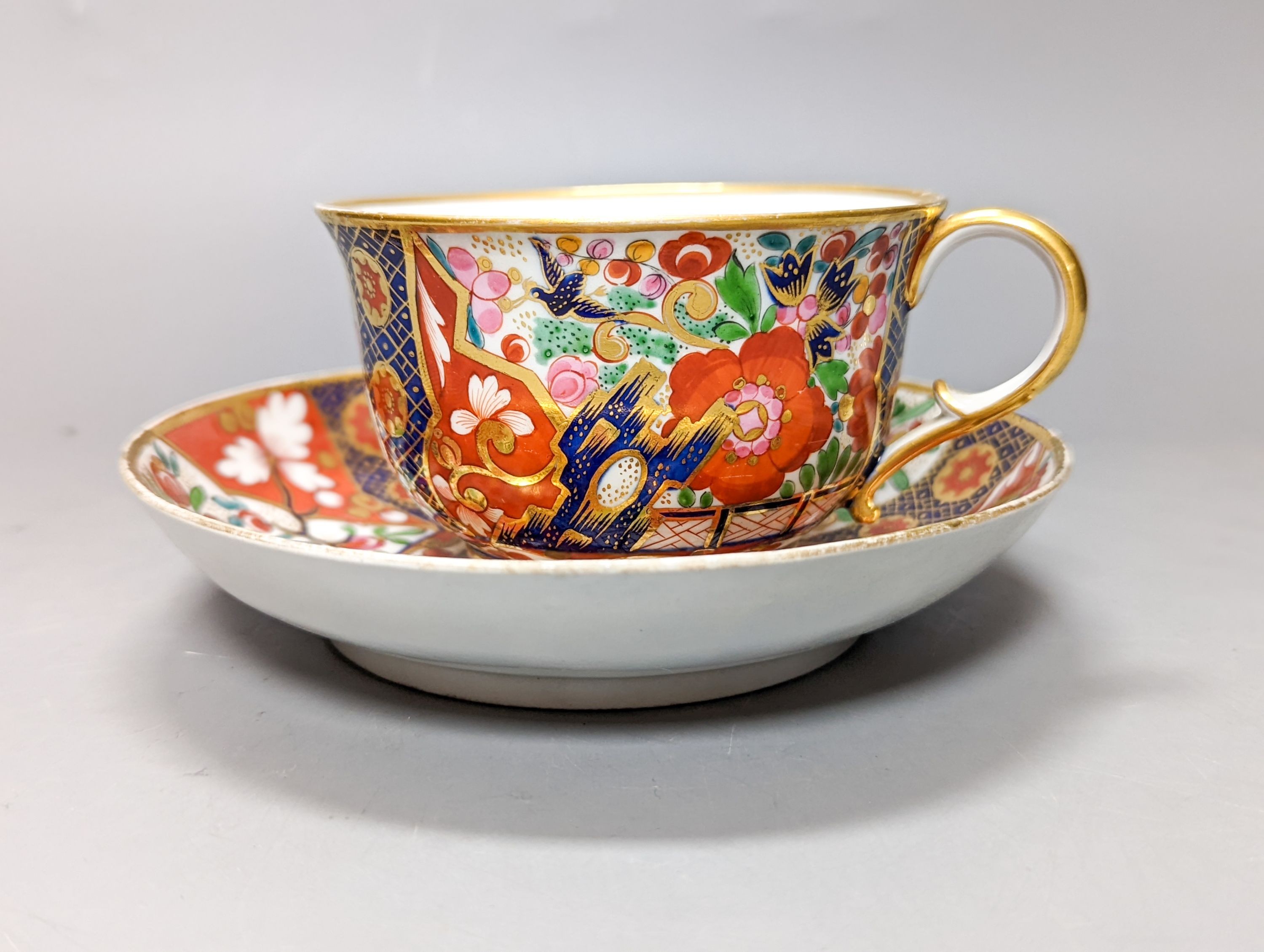 A pair of Chamberlain's Worcester miniature vases and Barr, Flight & Barr Worcester tea cup and saucer, early 19th century